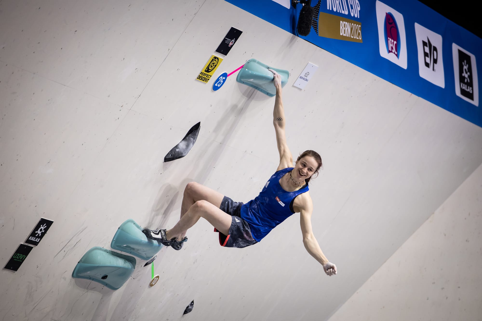 Erin McNice celebrating topping the 3rd boulder