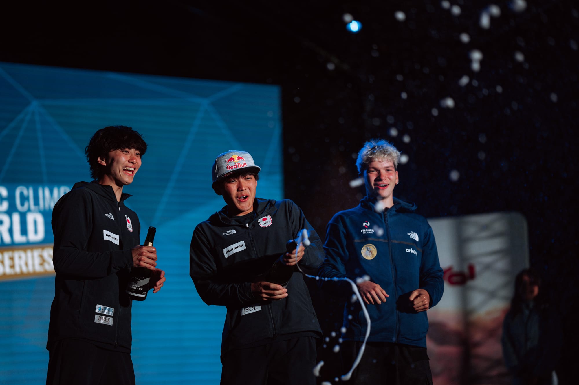 Sorato Anraku celebrating his series win with a bottle of champagne