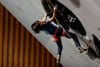 Ai Mori reaching the headwall on the difficult final route in Wujiang
