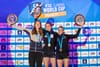 Vita Lukan, Eliska Adamovska and Manon Hily on the podium with their trophies and medals at the 2023 Briançon Lead World Cup.