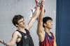 Sam Watson and Peng Wu hold up each other's hands after the big final race.