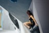 Oriane Bertone crouched under the roof of the EP Titan Boulder wall